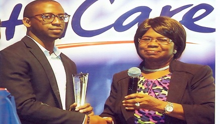 Prof. Ainsete presenting post humous award to Dr. Adadevoh's son